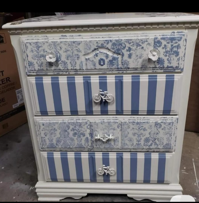 Restored vintage dresser with floral pattern